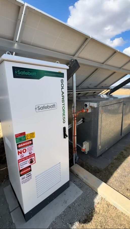 SolarStore50 installed beside shed under solar canopy