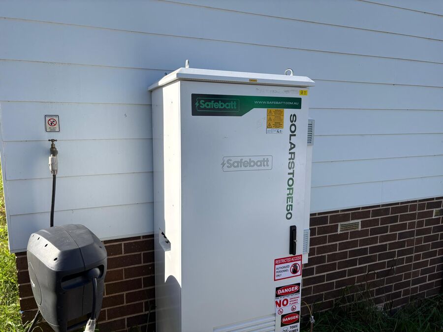 SolarStore battery installed on weatherboard home